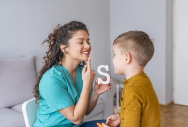 Cute little boy at speech therapist office