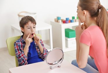 Cute little boy at speech therapist office
